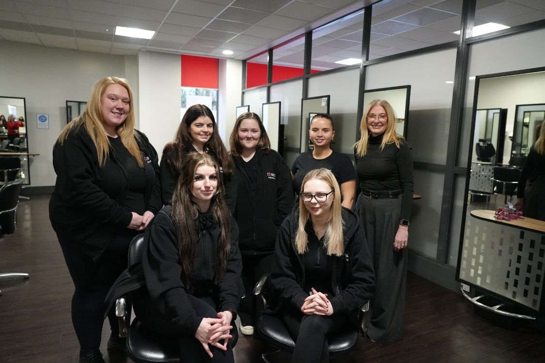 (L – R) Emily McConnell, Ellie Richardson, Jessica Hamilton, Megan Roberts, Demi-Lee Tiffen, Becky Benson with Hairdressing Lecturer, Lynn Rainey.